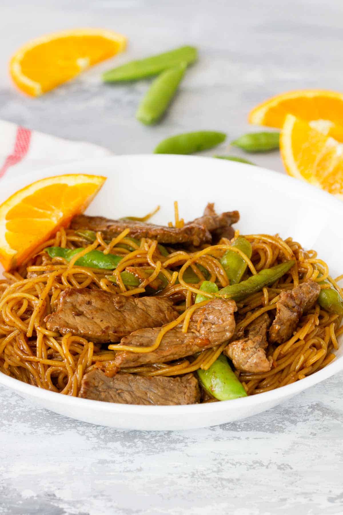 Serving of Orange Teriyaki Beef with Noodles in a bowl.