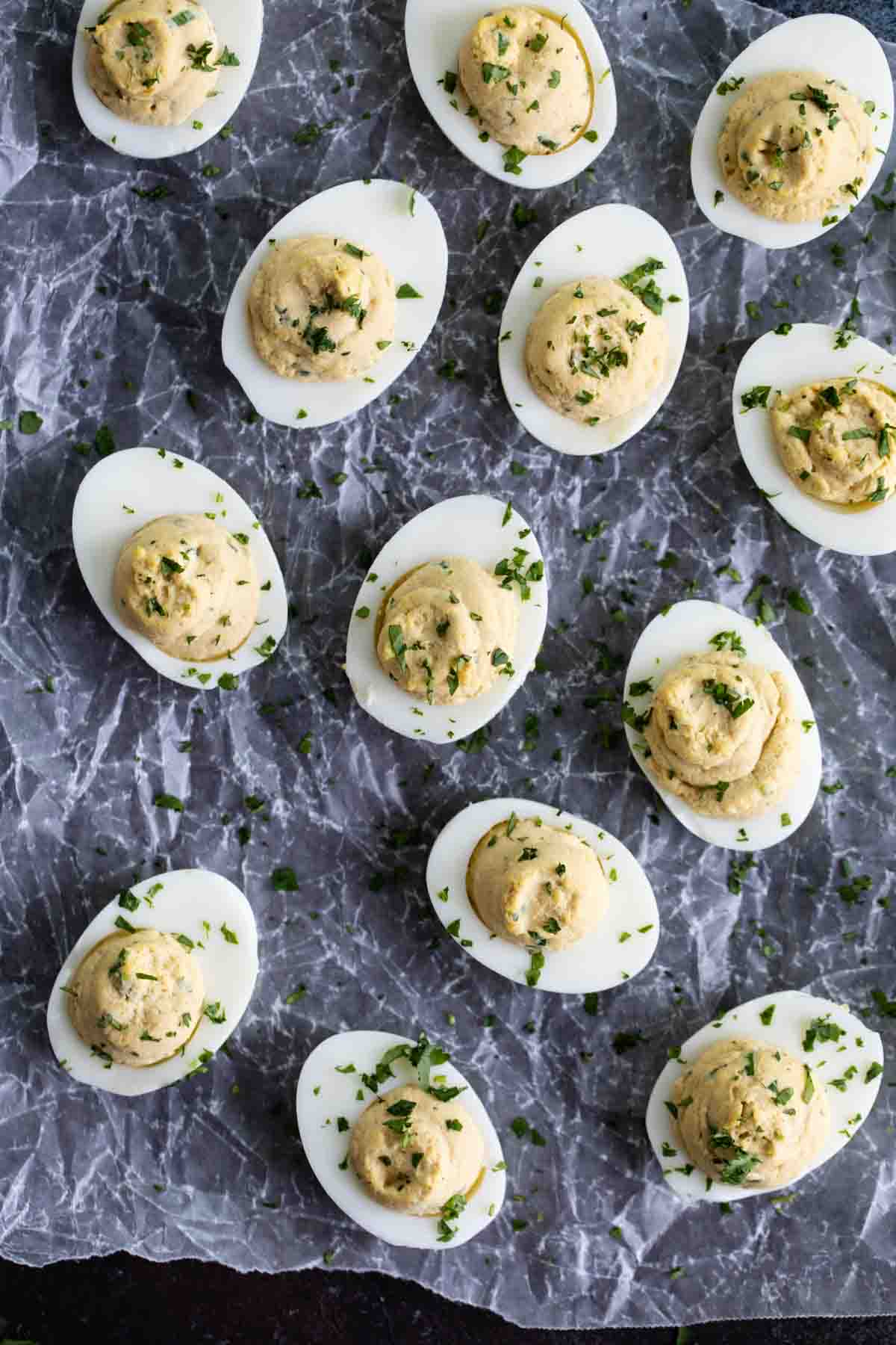 Asian deviled eggs topped with cilantro.