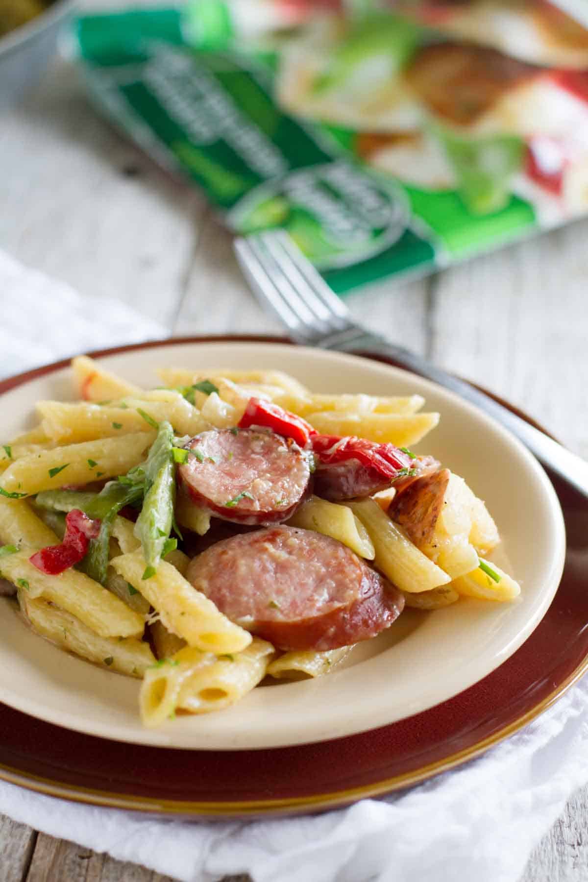 plate with skillet pasta with sausage