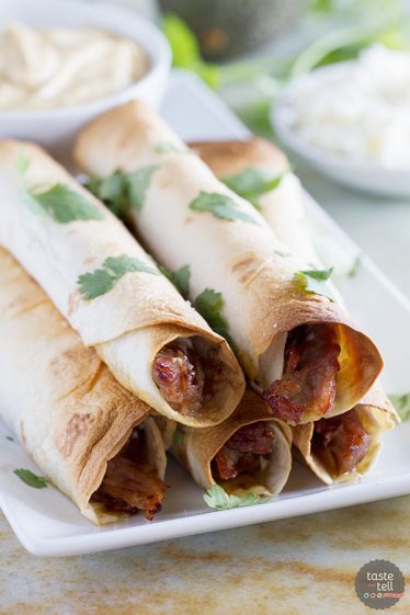 Slow Cooker Sweet Pork Baked Taquitos - Taste and Tell