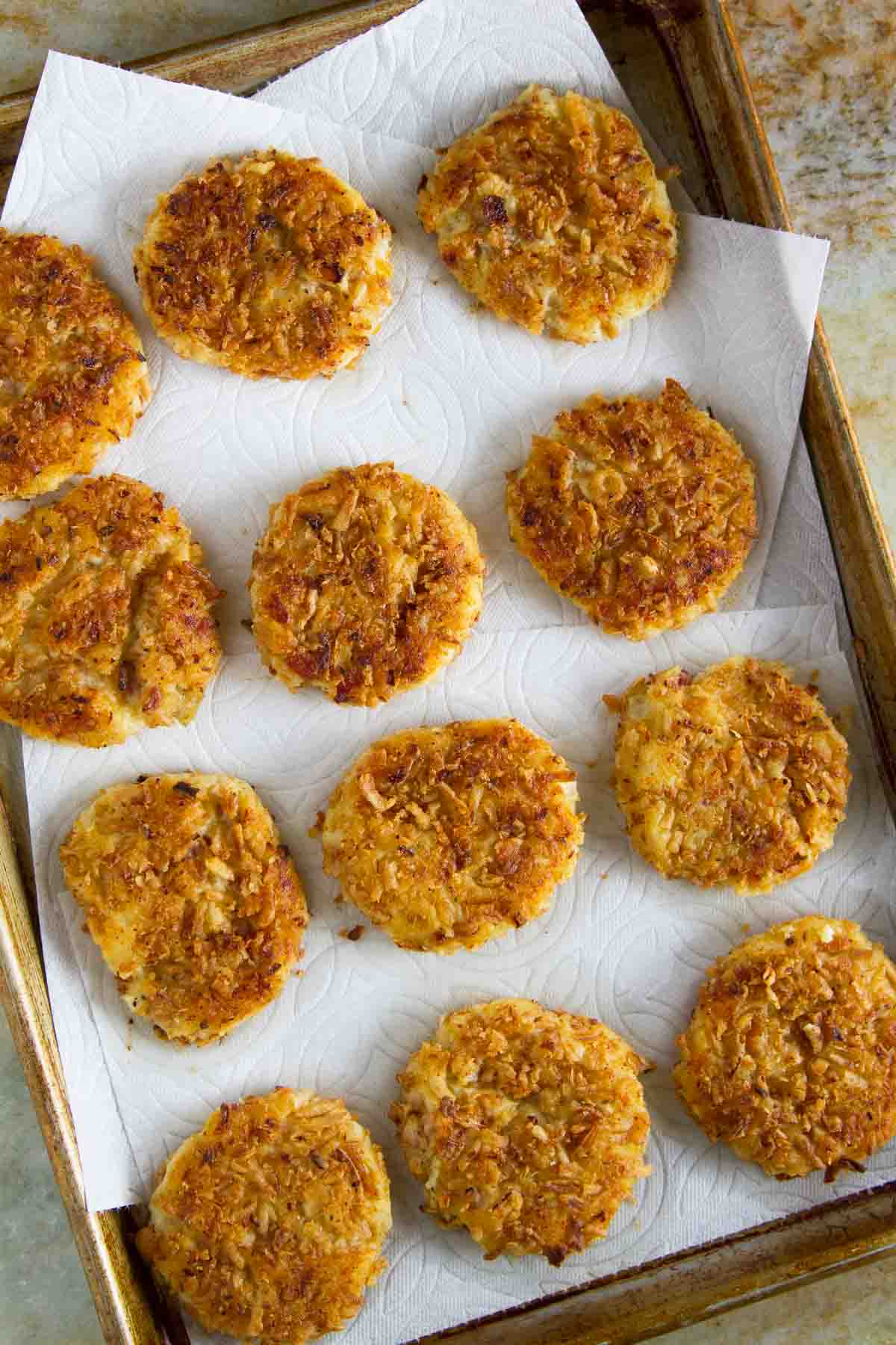 Crispy Onion Potato Pancakes on a baking sheet.