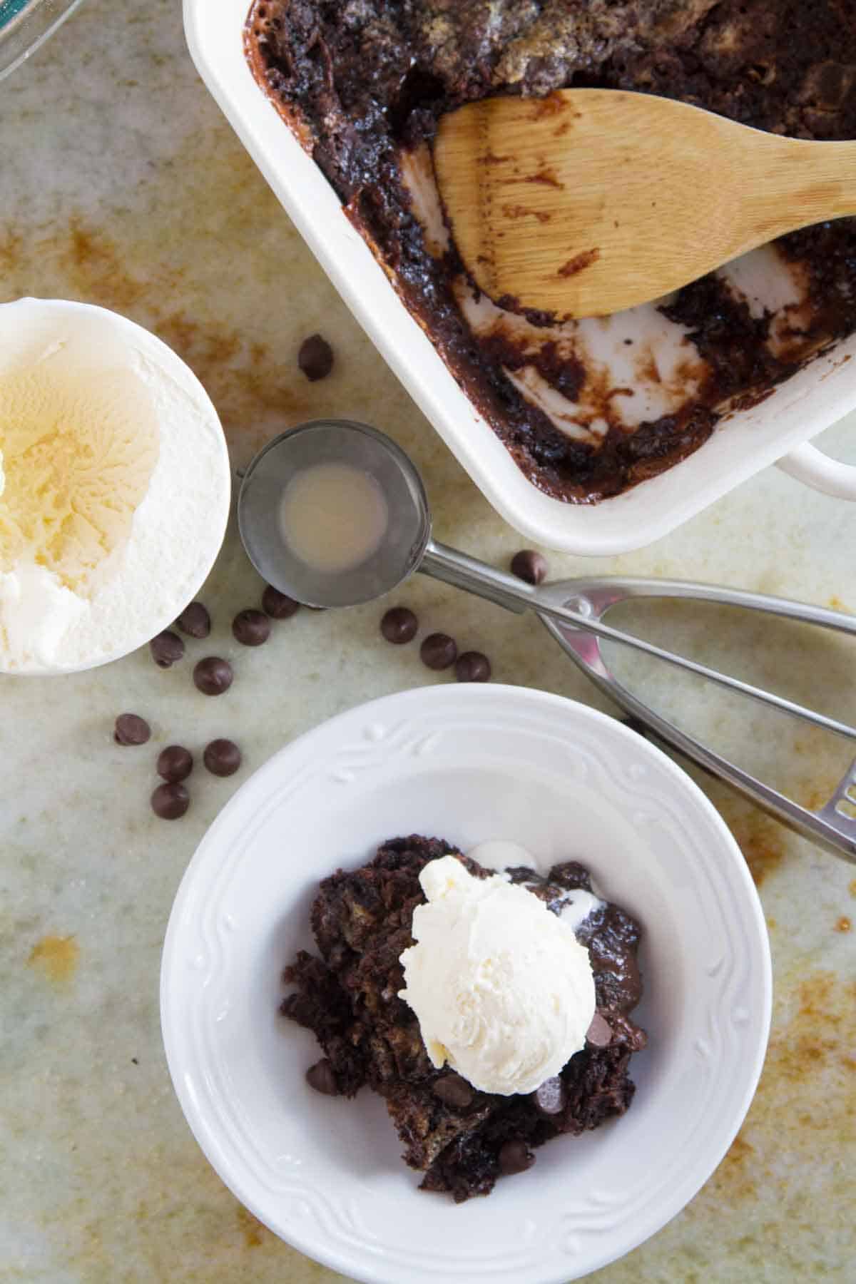 Caramel Chocolate Dump cake topped with vanilla ice cream.