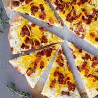 Bacon and Spiralized Butternut Squash Pizza cut into slices.