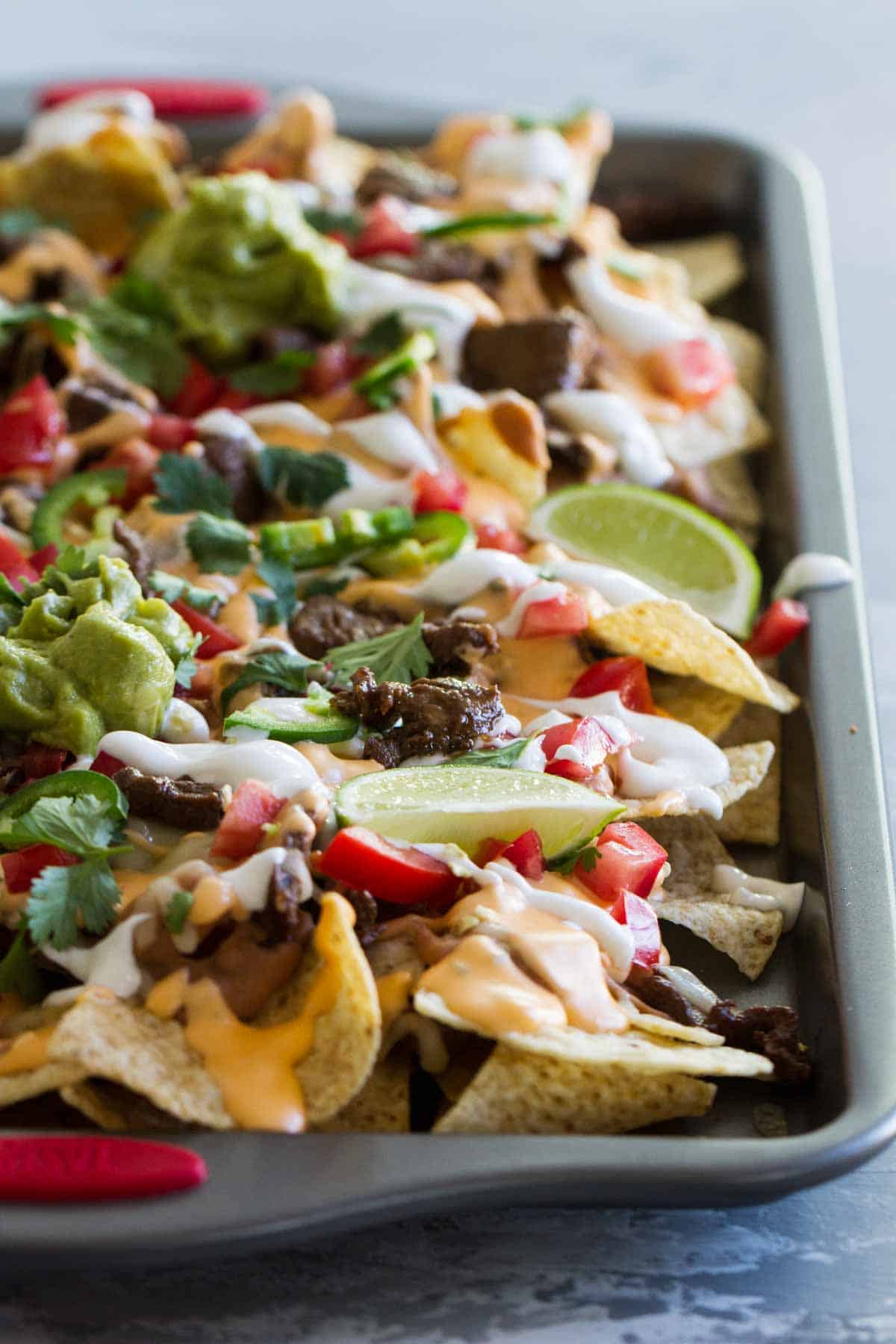 Sheet Pan Nachos Supreme with steak.