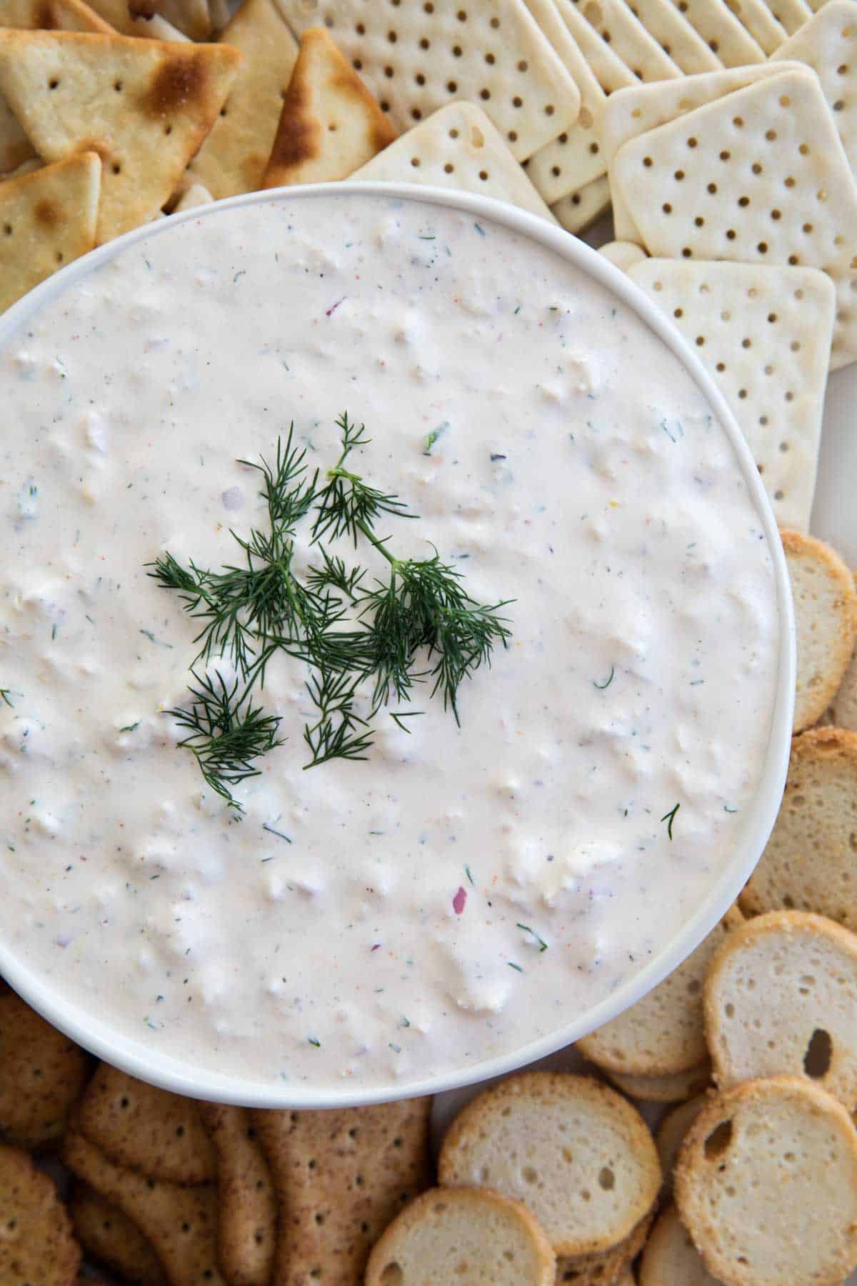 Cold Crab Dip Recipe surrounded by crackers.