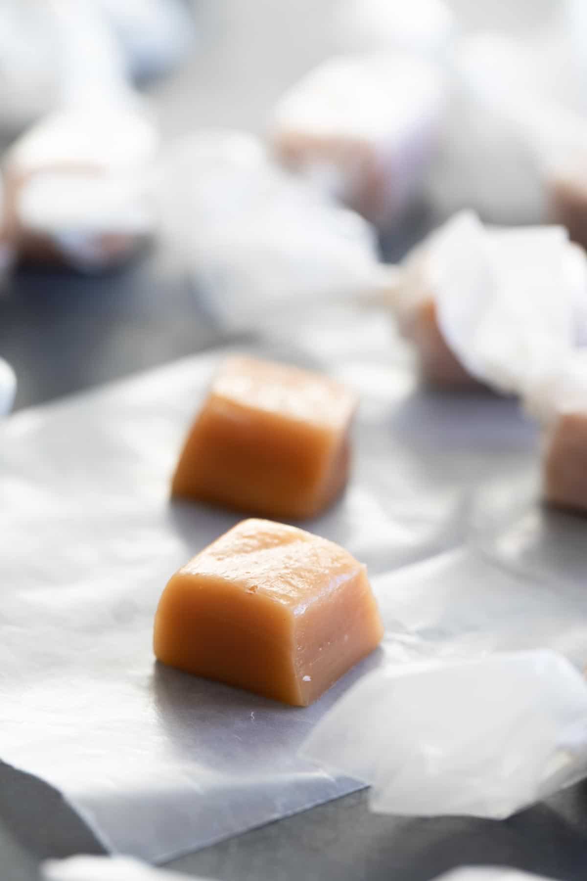 https://www.tasteandtellblog.com/wp-content/uploads/2020/12/Homemade-Caramel-Candy-vertical.jpg
