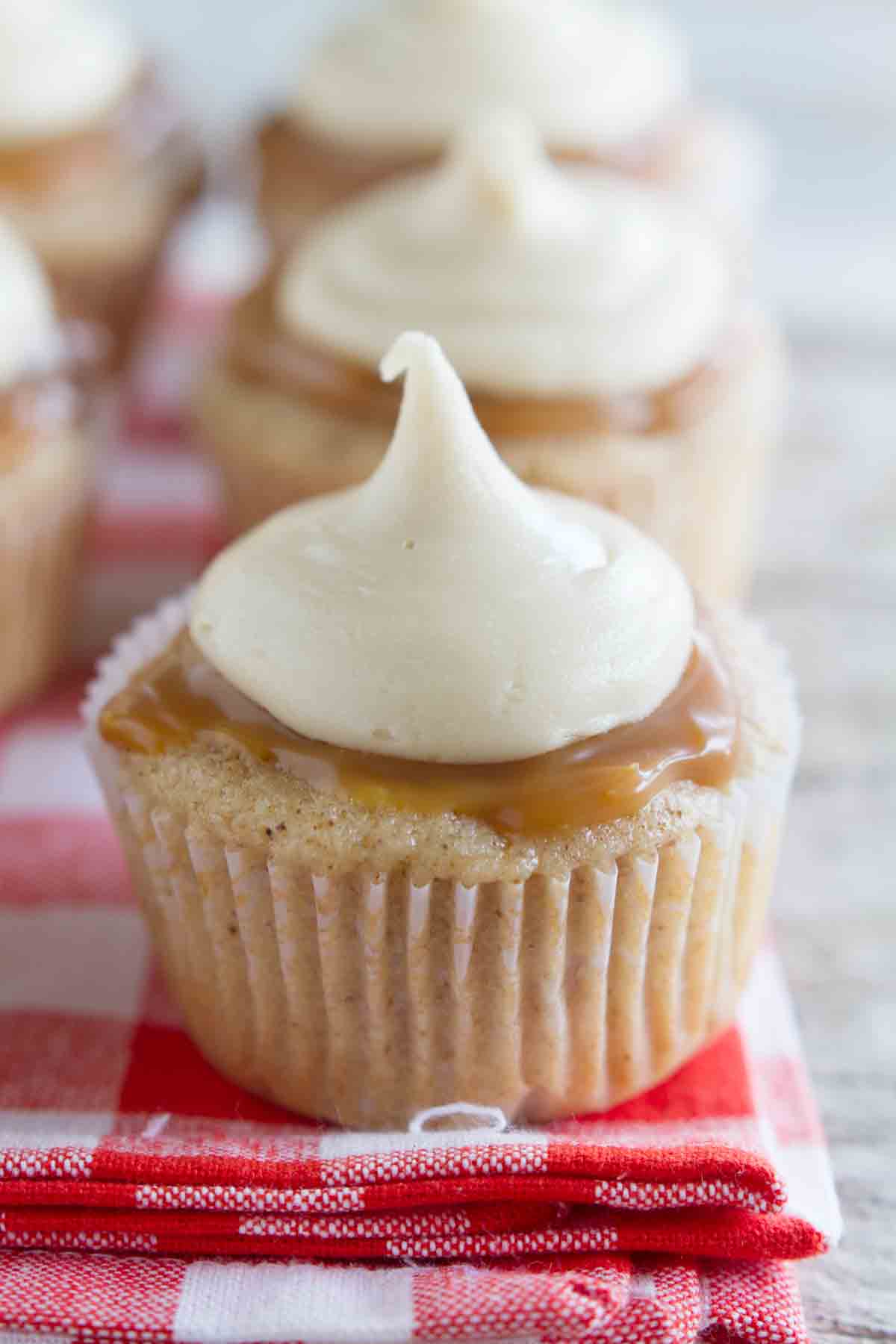 Caramel Apple Cupcakes topped with caramel and buttercream