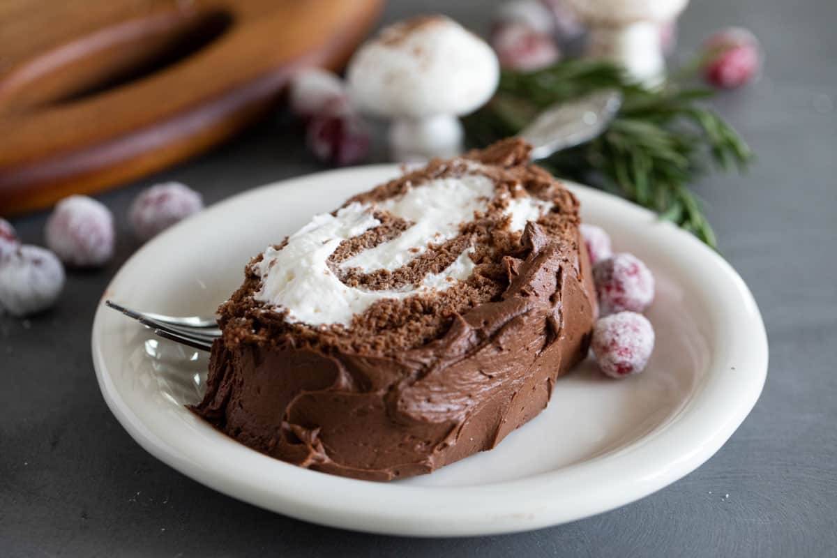 Slice of Bûche de Noël on a plate.