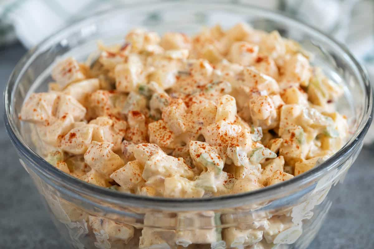 Glass bowl filled with potato salad.