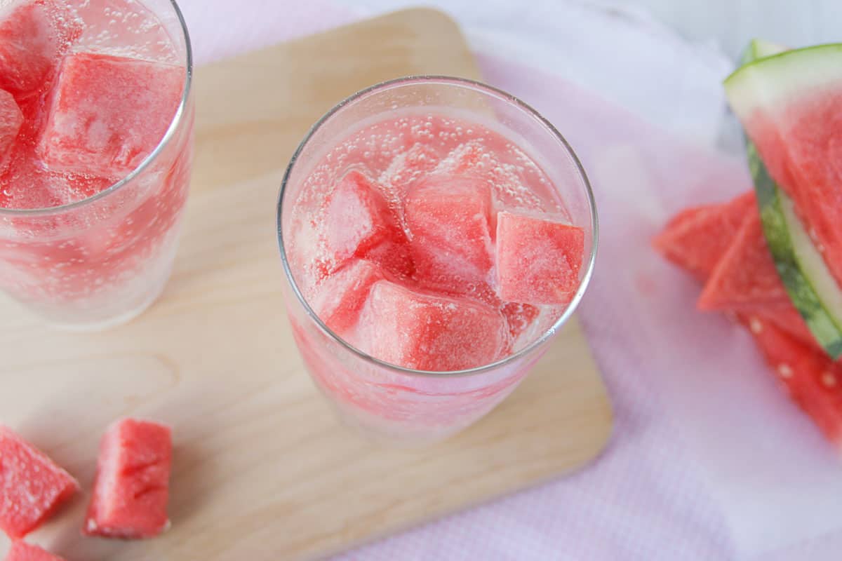 Frozen watermelon cubes in a glass.