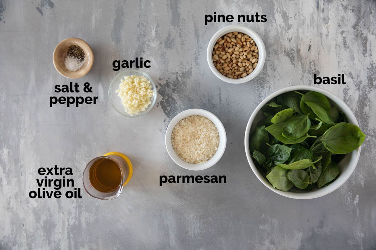 Ingredients needed to make basil pesto.