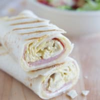 Grilled Chicken Cordon Bleu Wrap cut in half to show interior.