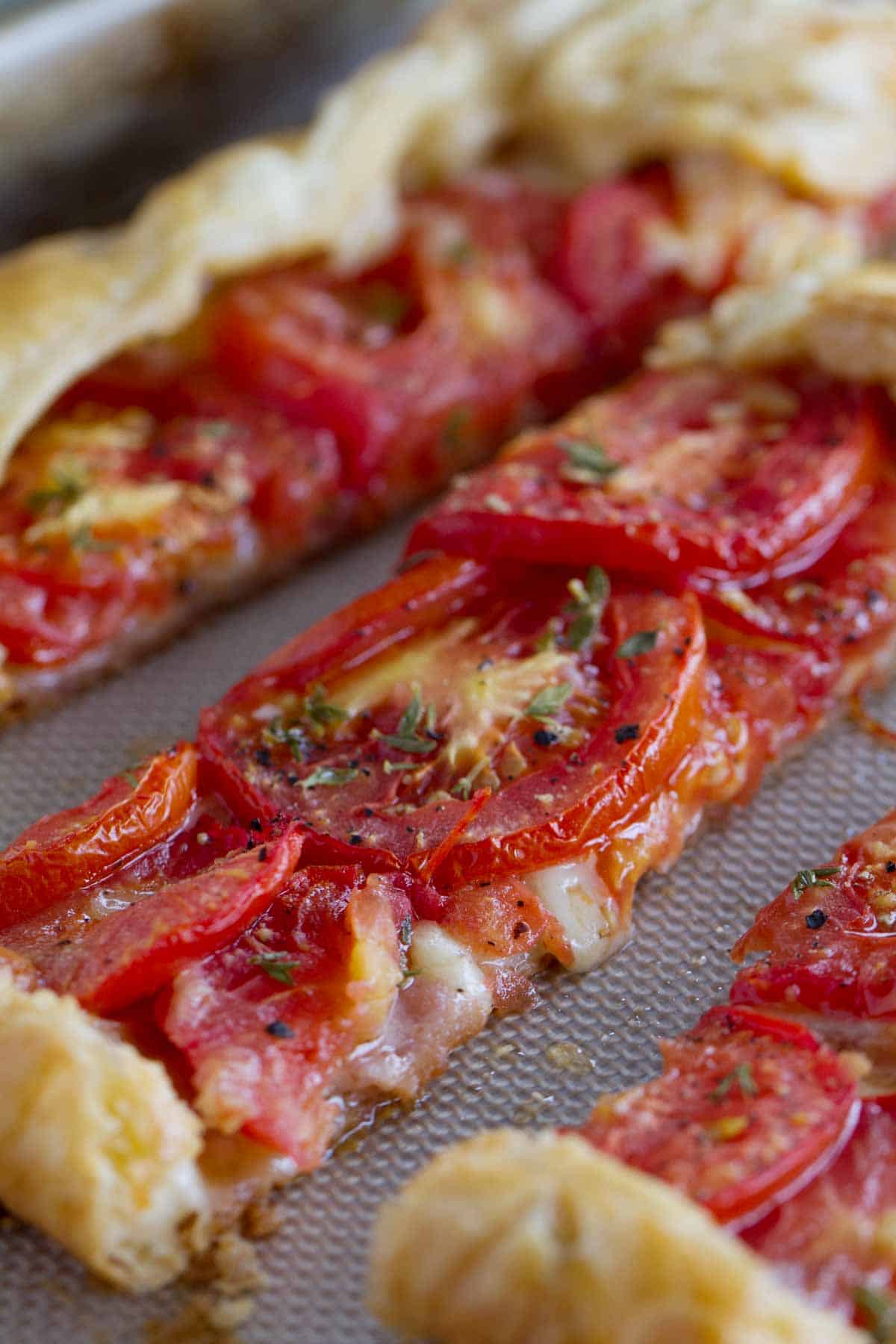 Slices of Tomato Tart with Bacon and Gruyere.