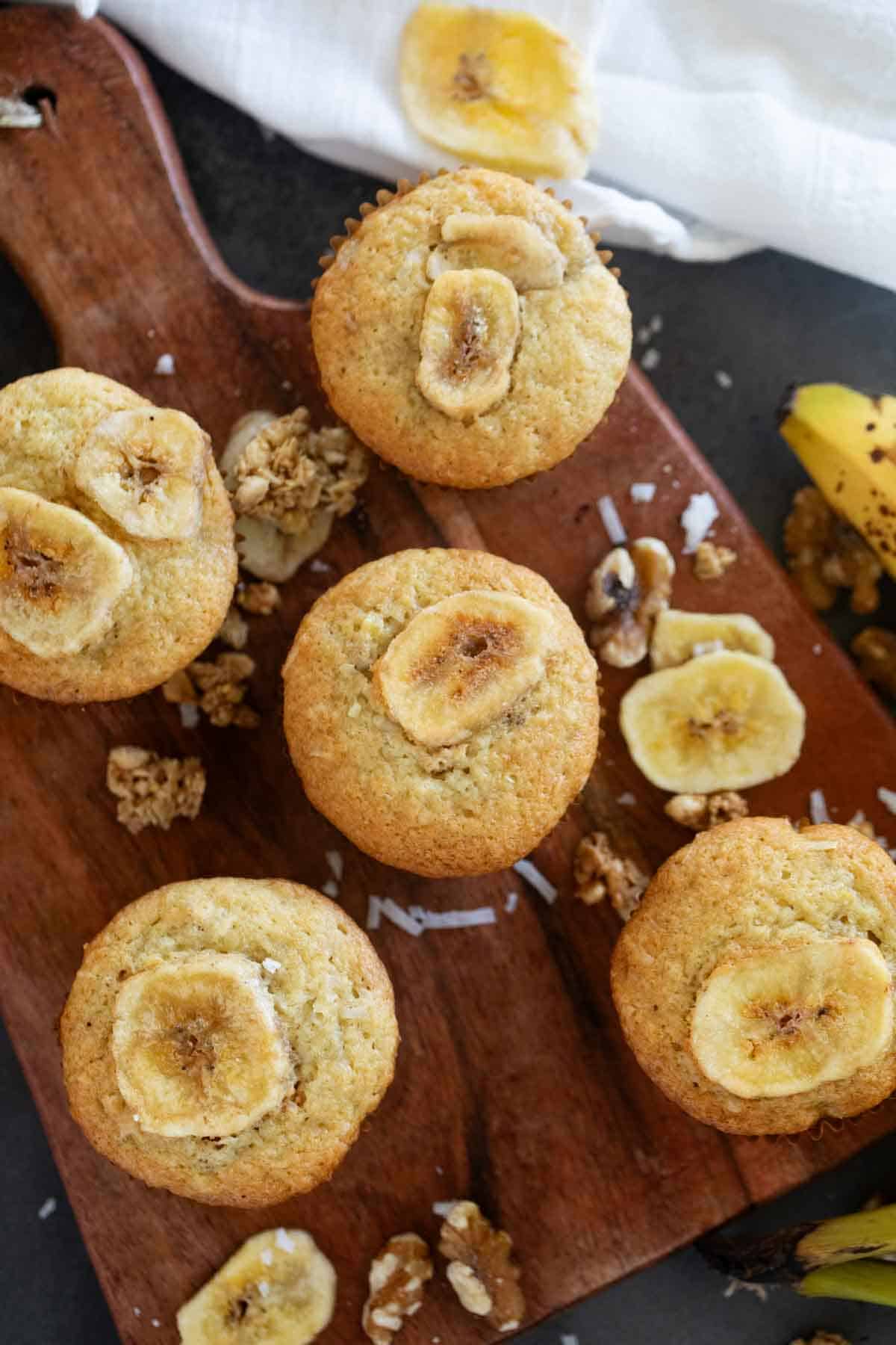 Banana Crunch Muffins topped with banana chips.