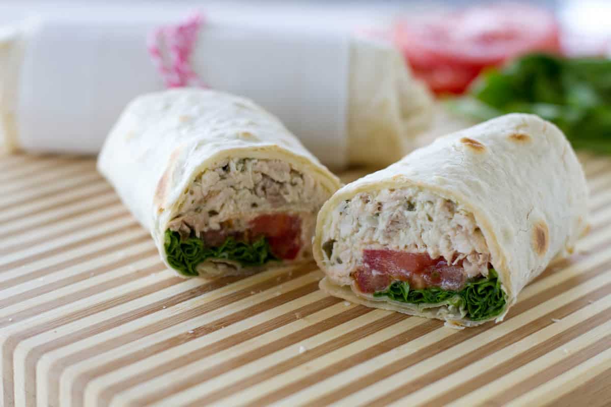 Chicken Pesto Wrap cut in half to show interior of wrap.