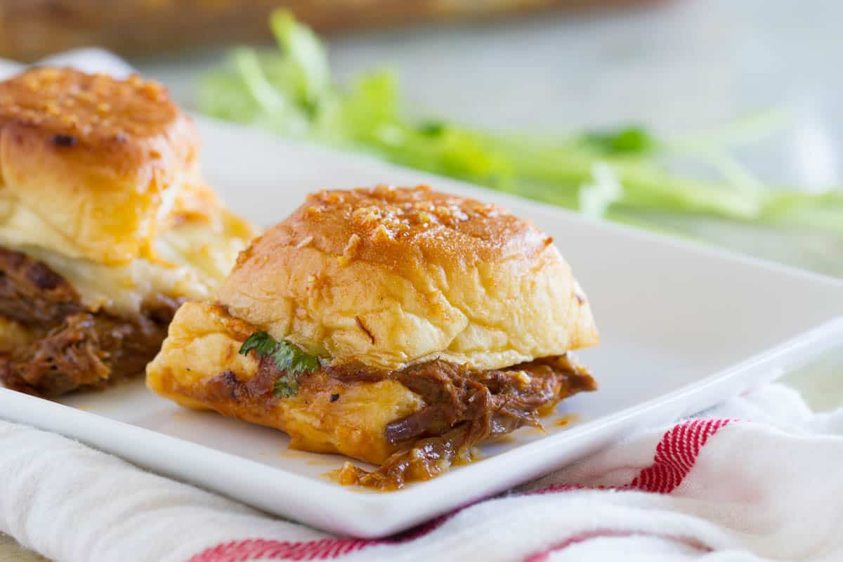 Individual Enchilada Beef Sliders on a plate.