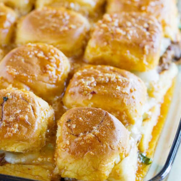 Enchilada Beef Sliders in a glass baking dish.