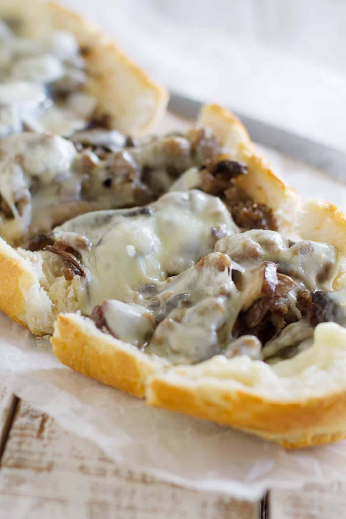 French bread pizza topped with sausage, portobello mushrooms, and cheese.