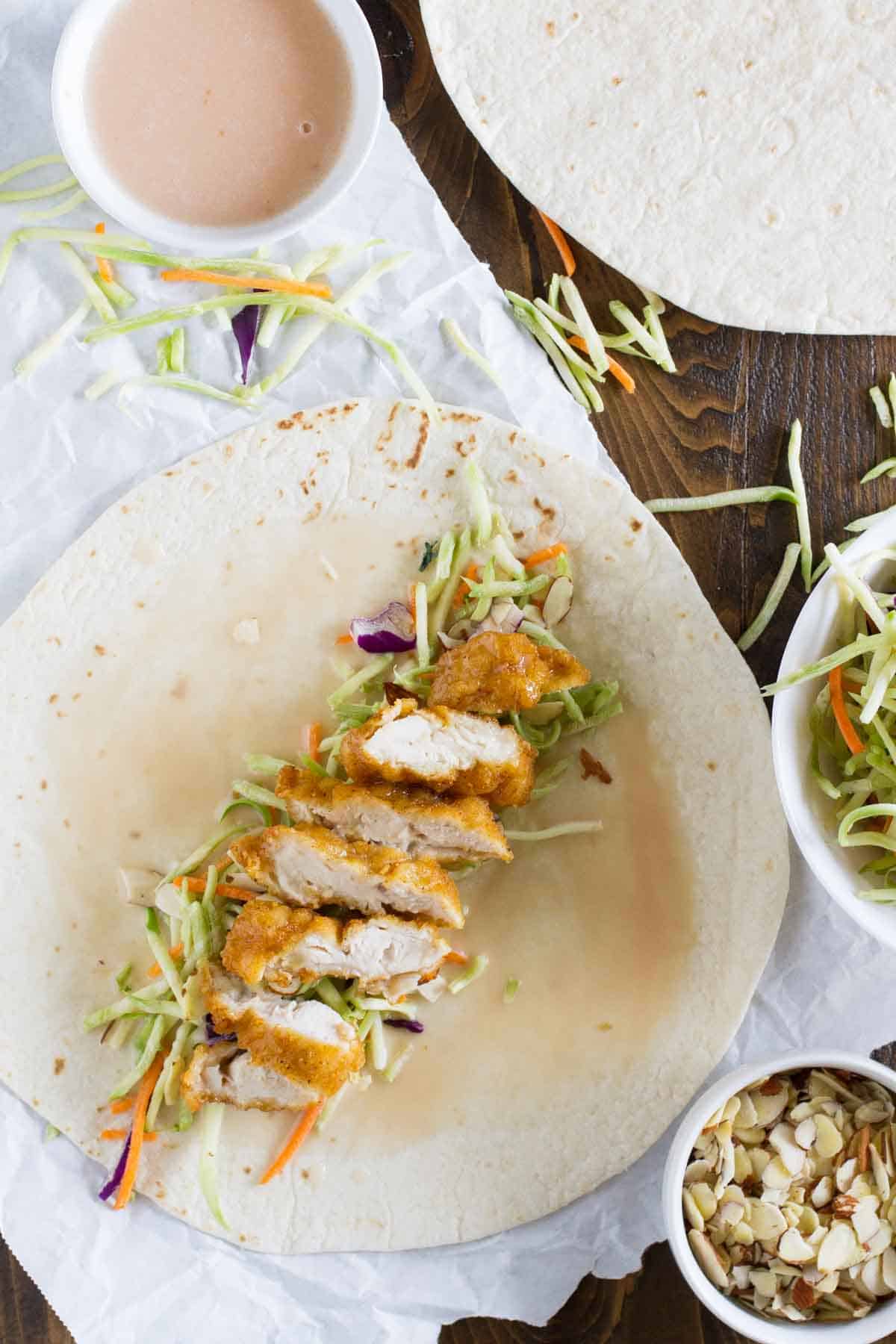 Easy honey sesame chicken salad wraps with homemade dressing.