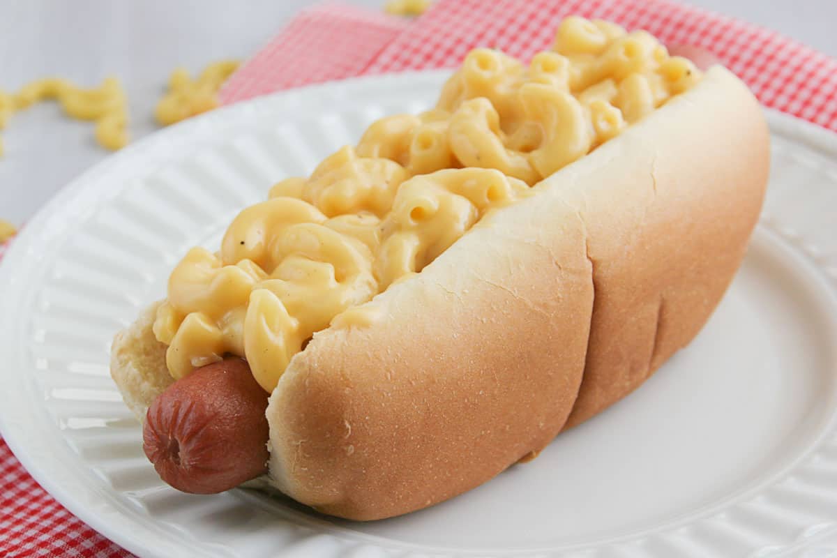 Mac and Cheese Hot Dogs topped with homemade macaroni and cheese.