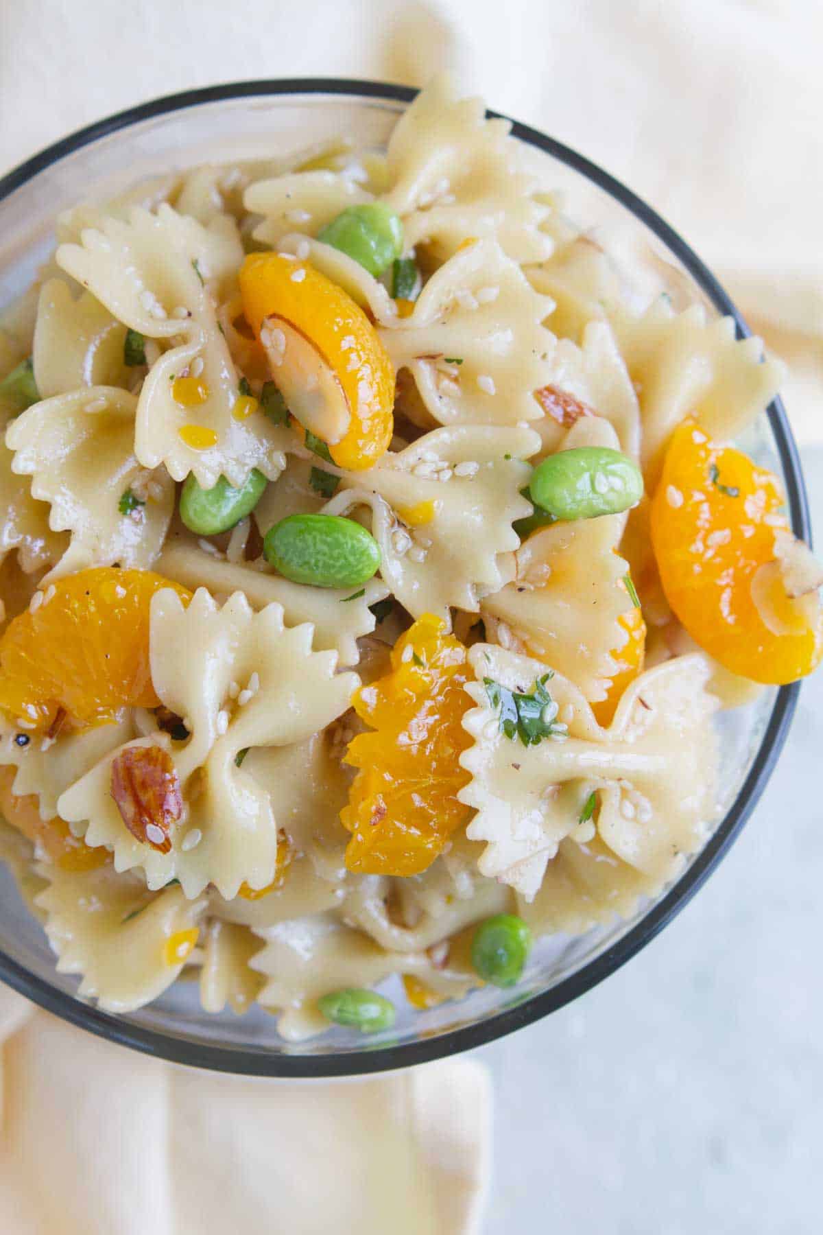 Overhead view of Oriental Pasta Salad with edamame and oranges.