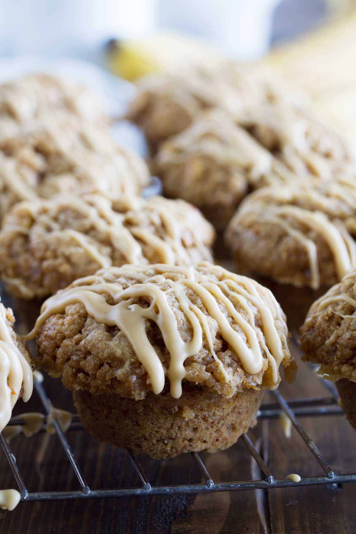 Peanut Butter Banana Bran Muffins with glaze on a cooling rack.