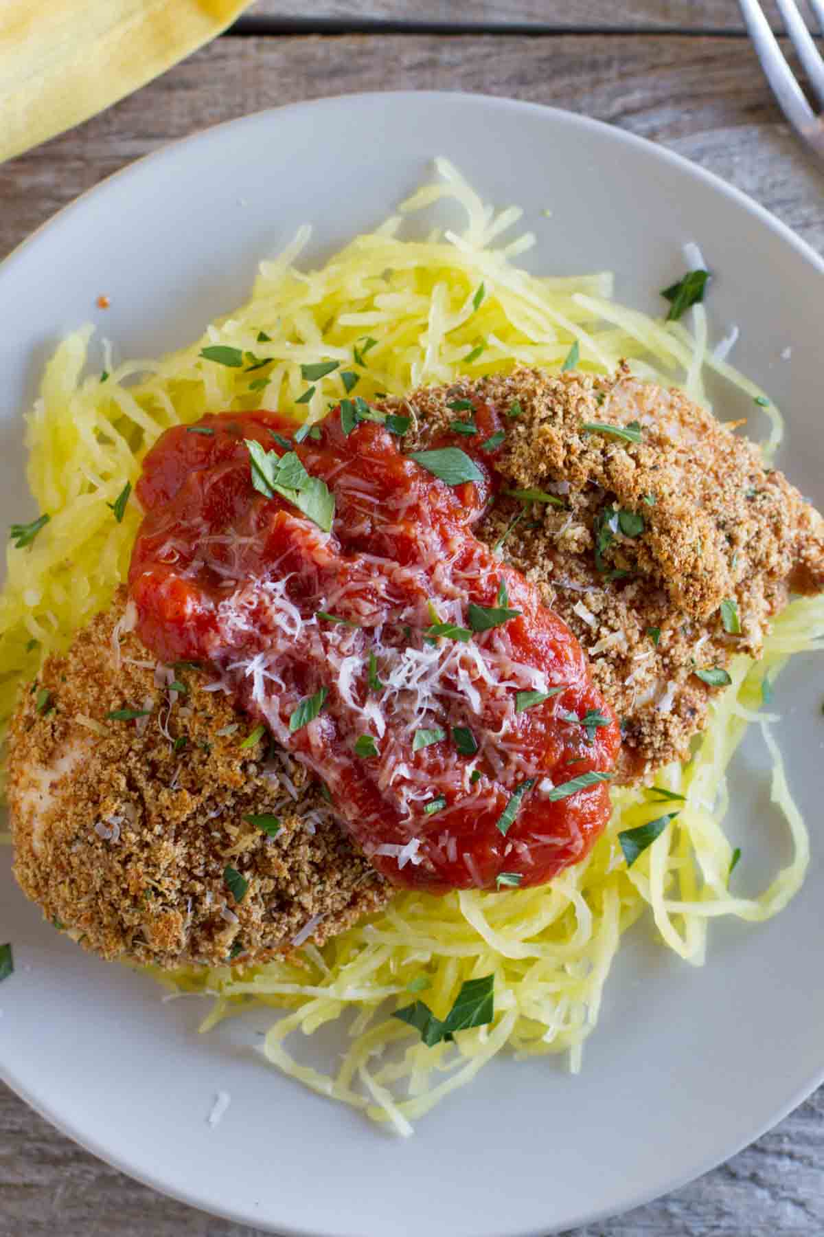 Baked Chicken Parmesan over spaghetti squash.