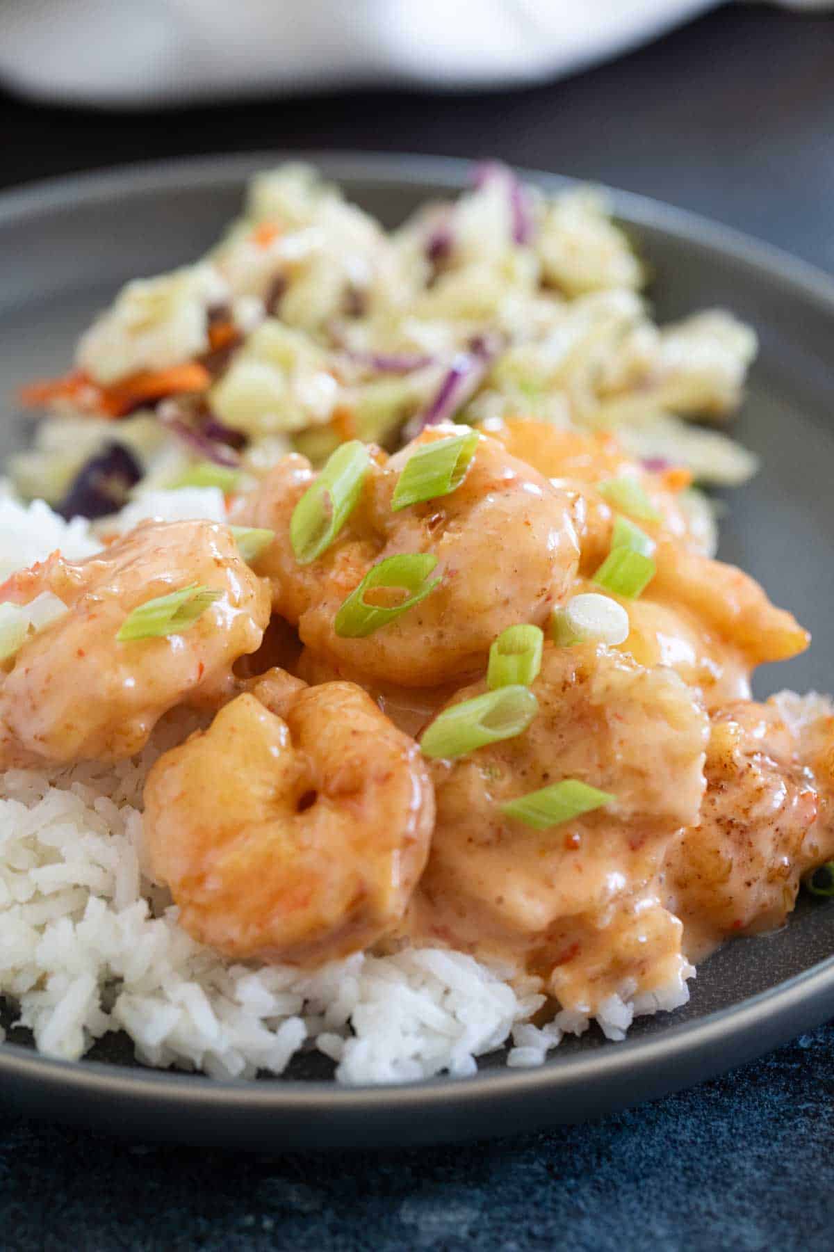 Bang Bang Shrimp (Firecracker Shrimp) served over rice with Asian slaw.