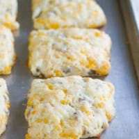 Cheddar Sausage Biscuits on a baking tray.