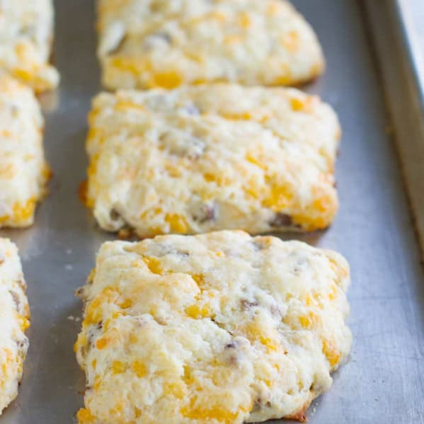 Cheddar Sausage Biscuits on a baking tray.