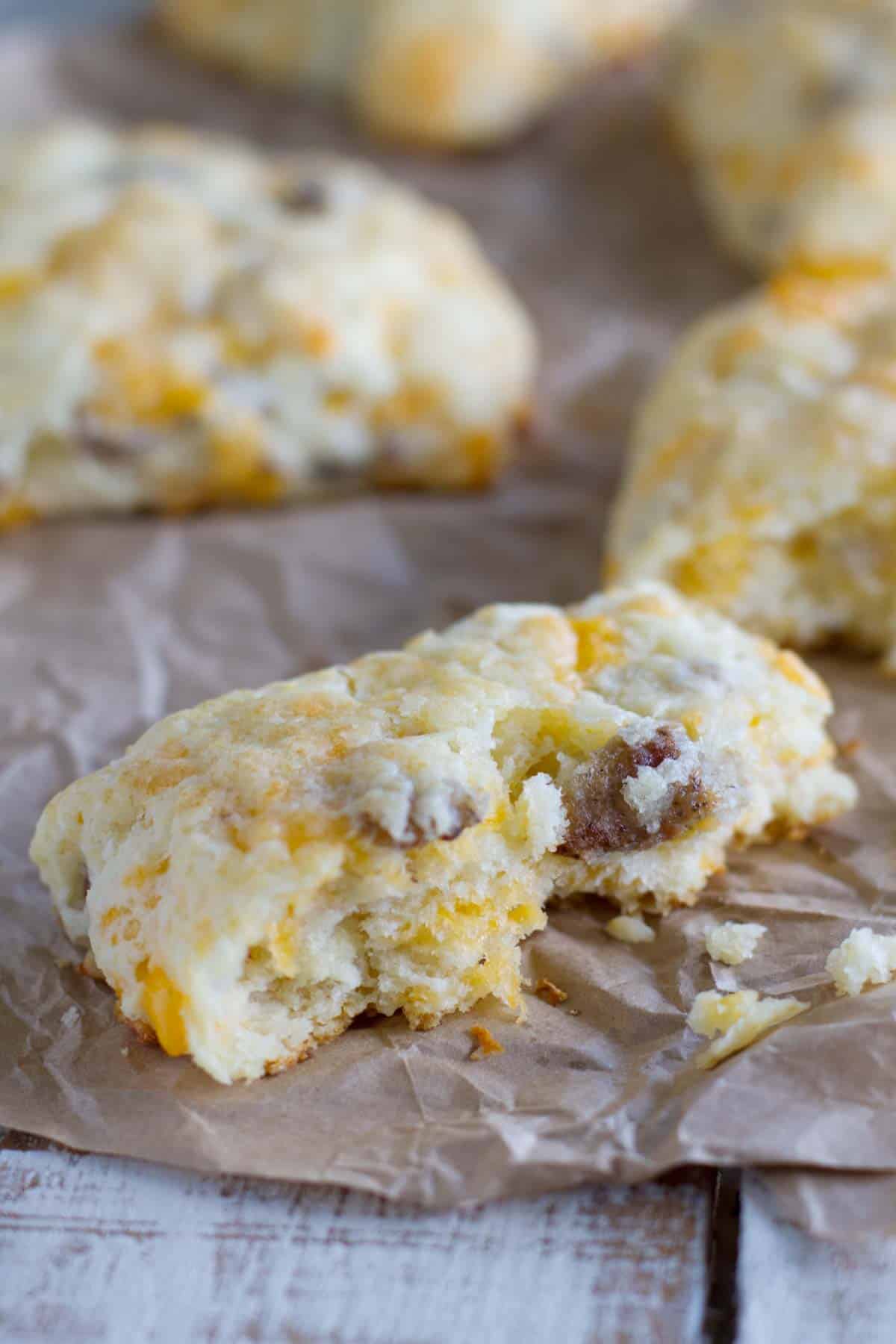 Cheddar sausage biscuit broken in half to show interior texture.