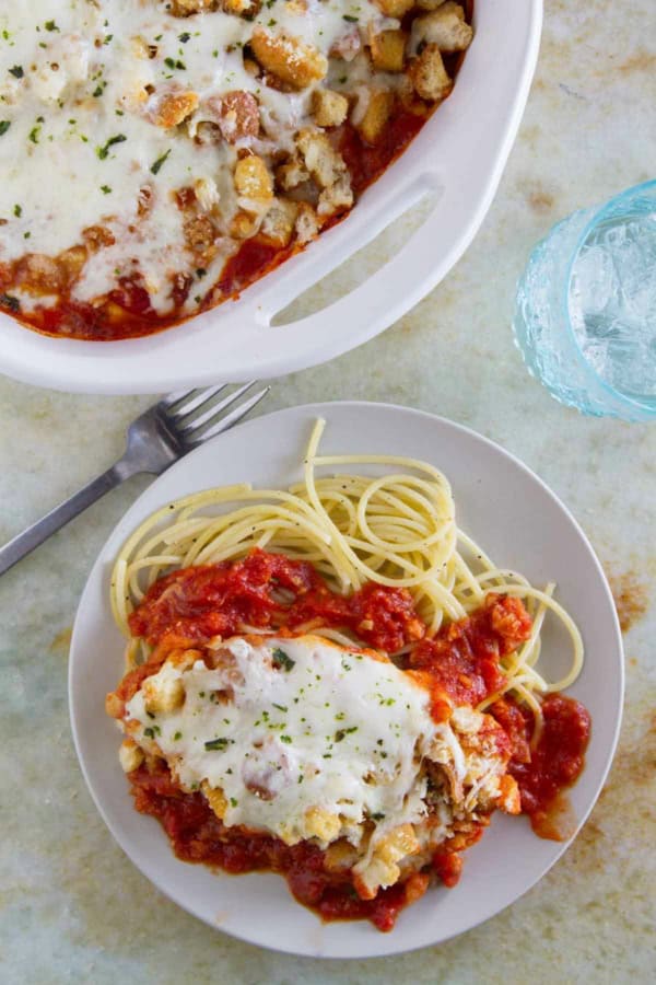 Chicken Parmesan Casserole served over spaghetti noodles.