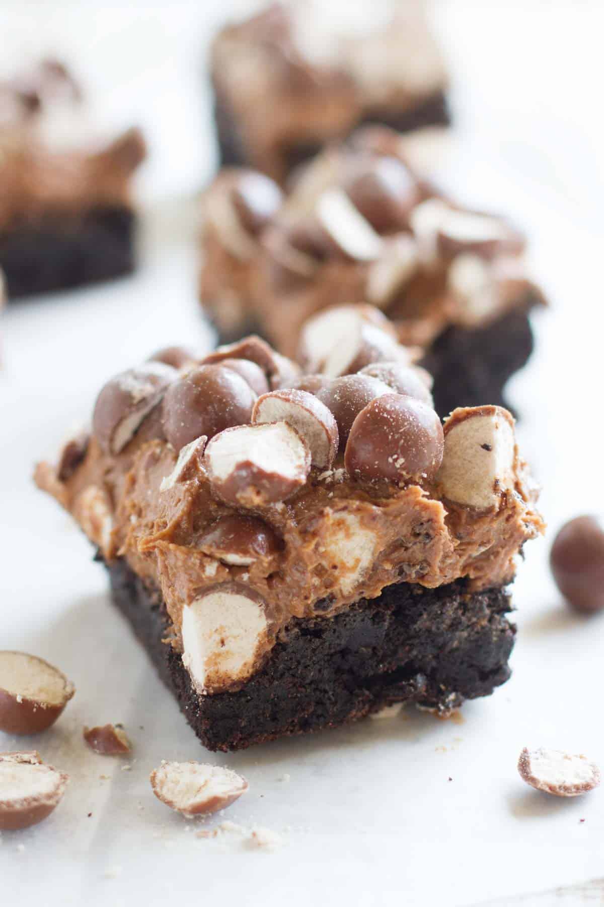 Dark chocolate brownie topped with malted frosting and malted milk balls.