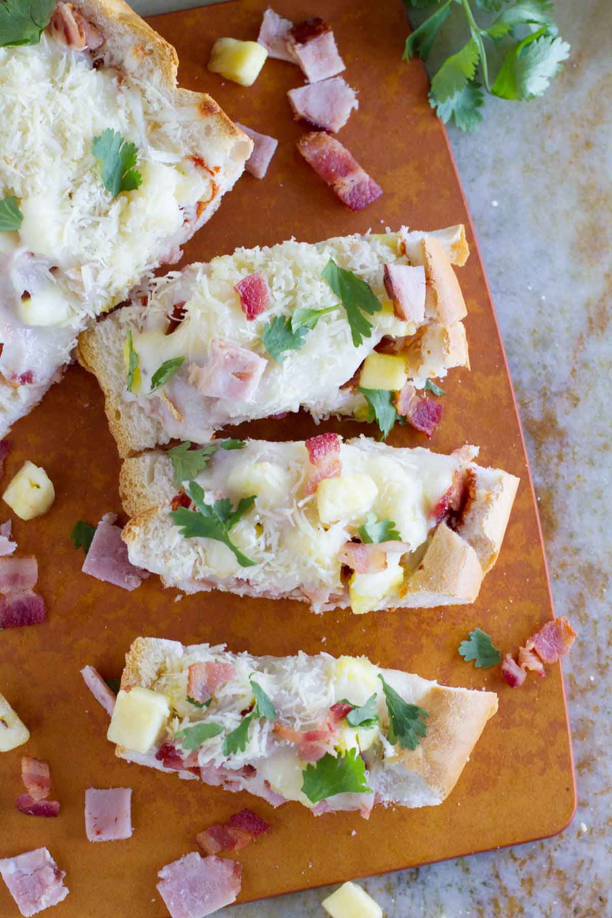 French Bread Hawaiian Pizza cut into slices.