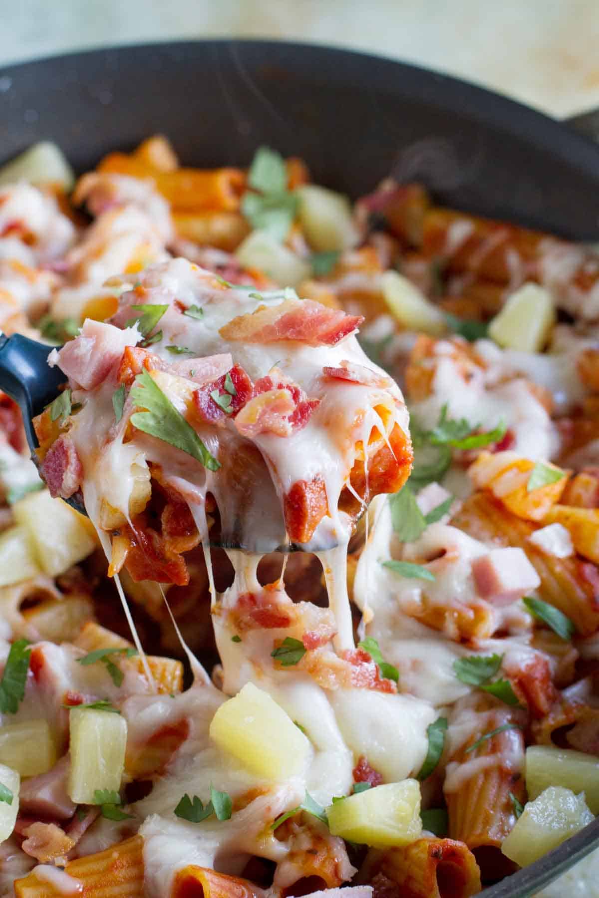 Scooping out a serving of Hawaiian One Pan Pasta.