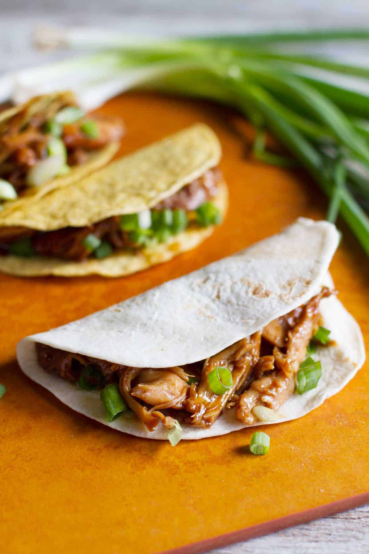 Honey Garlic Chicken Tacos made with soft and hard tortillas.