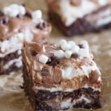 Marshmallow coconut brownies filled with Mallow Cups and topped with marshmallows and chocolate.