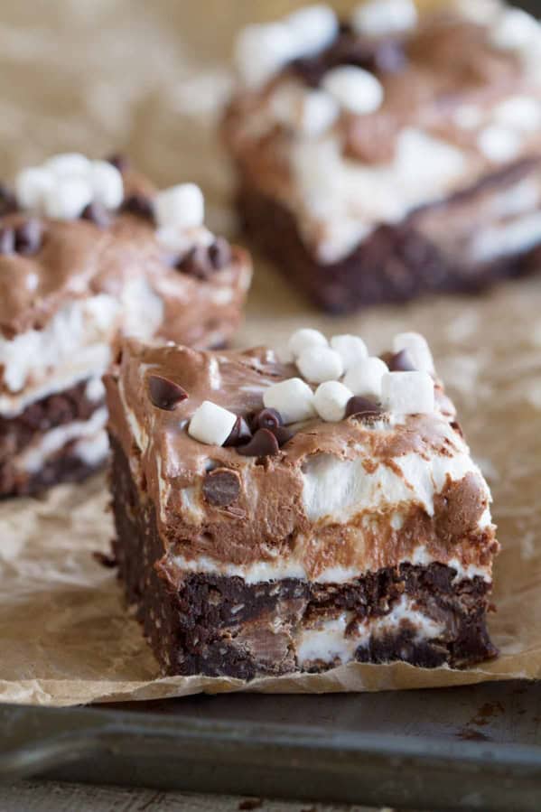 Marshmallow coconut brownies filled with Mallow Cups and topped with marshmallows and chocolate.