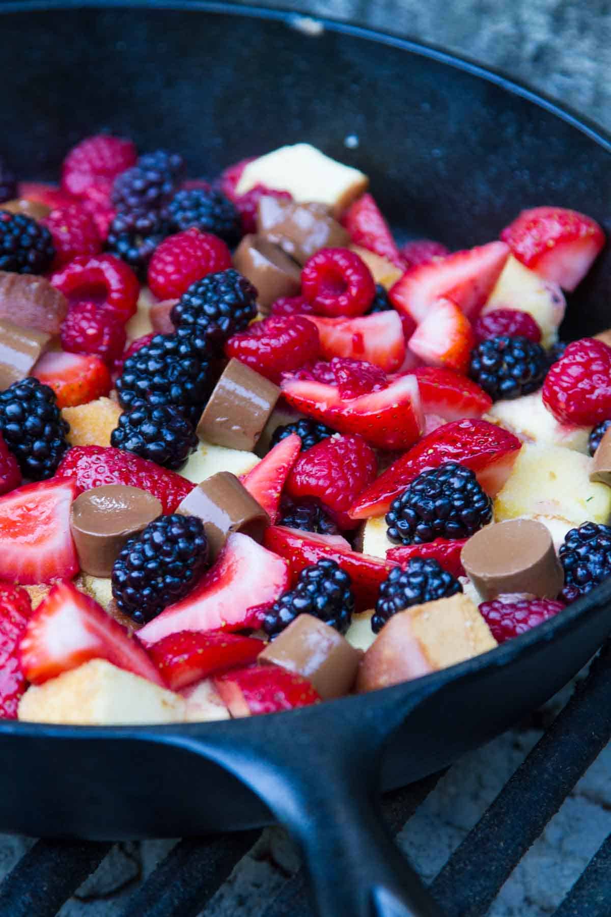 Pound Cake and Berry Campfire Skillet Dessert in a cast iron skillet.