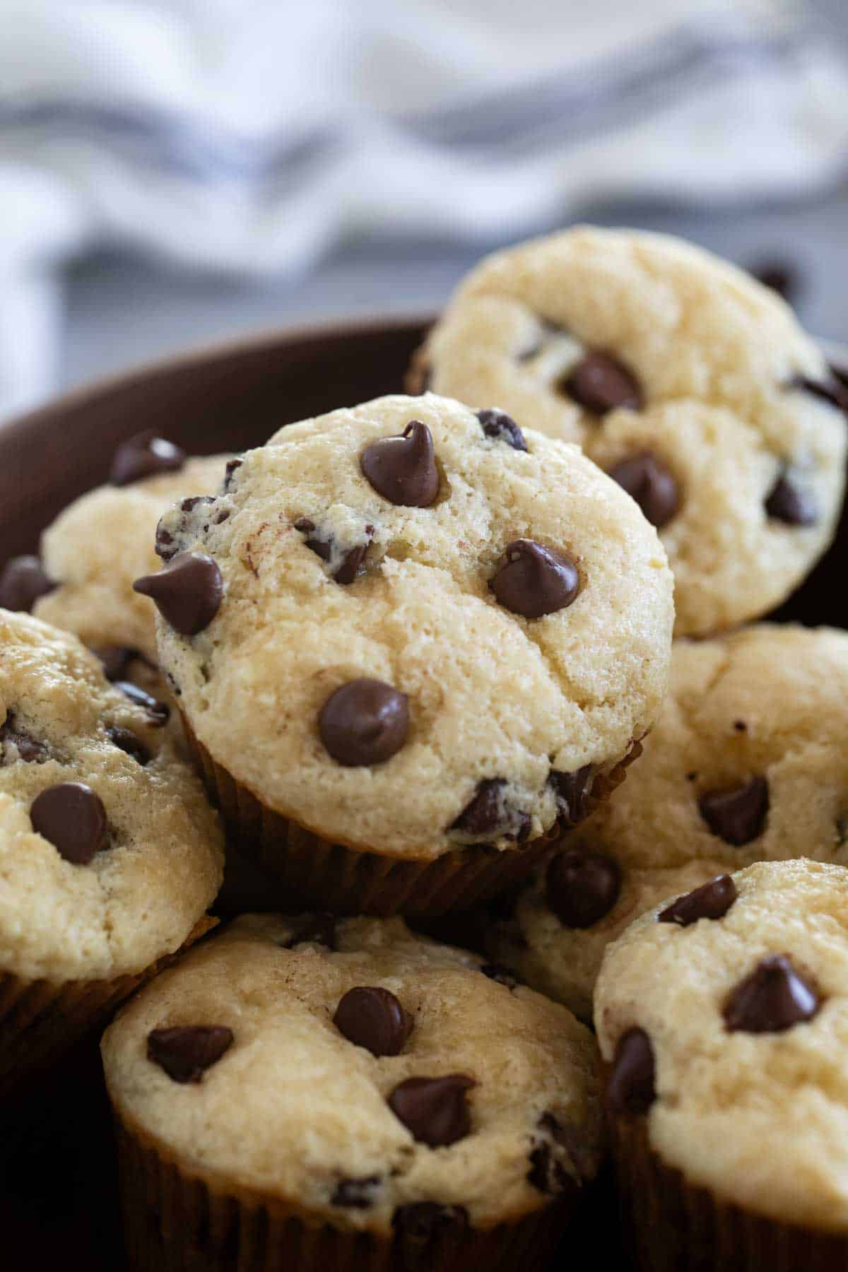 Bowl filled with Sour Cream Muffins with Chocolate Chips.