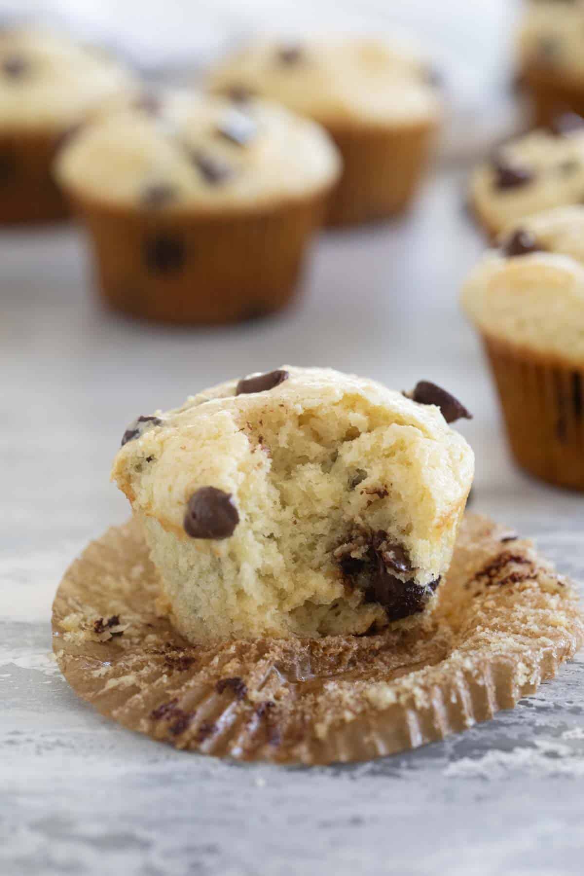 Sour Cream Muffin with chocolate chips with a bite taken from it.