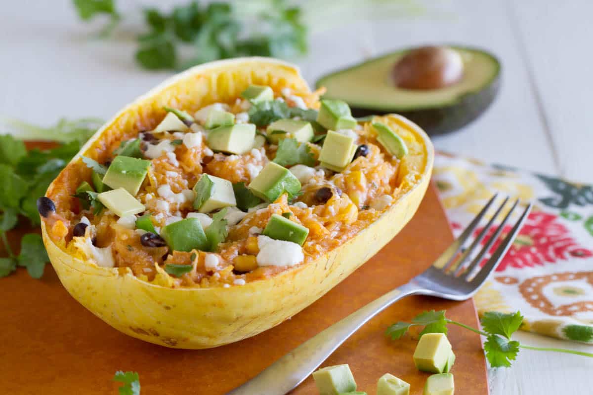 Stuffed spaghetti squash with beans, corn, and cheese.