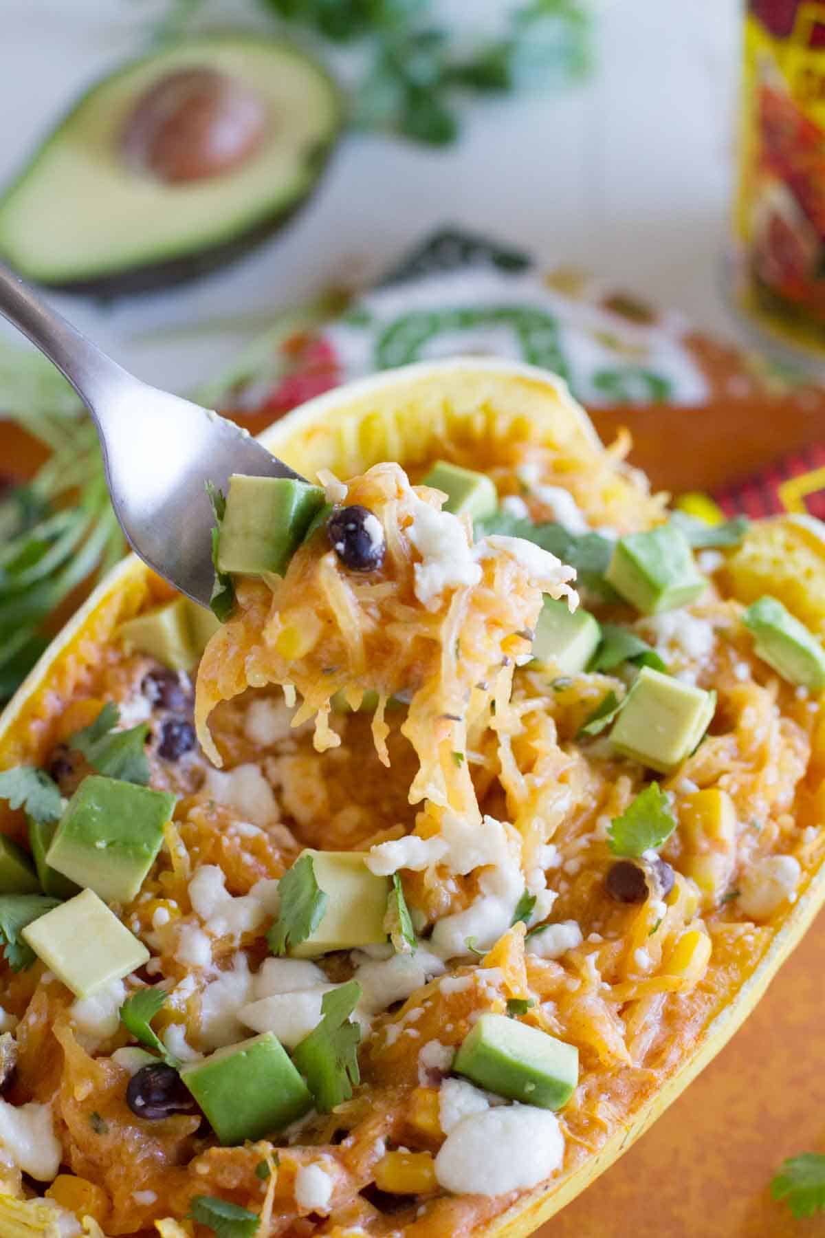 Fork full of southwestern stuffed spaghetti squash.