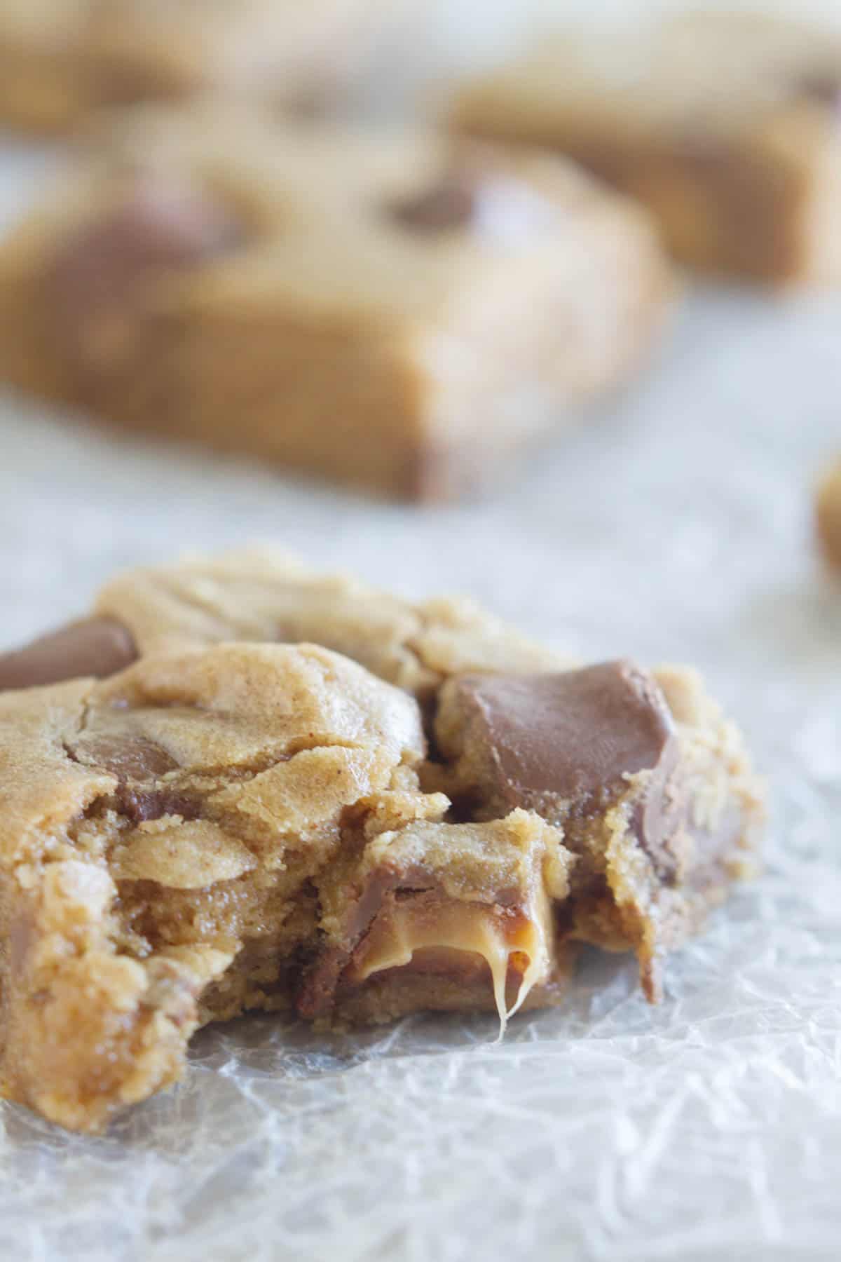 Spice Cake Caramel Blondies with a bite taken from it.