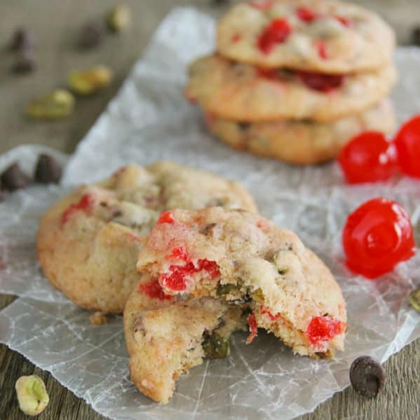 Cherry Chocolate Nut Cookie broken in half, sitting on another cookie.