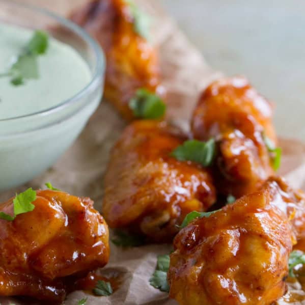 Enchilada Chicken Wings with cilantro dipping sauce.