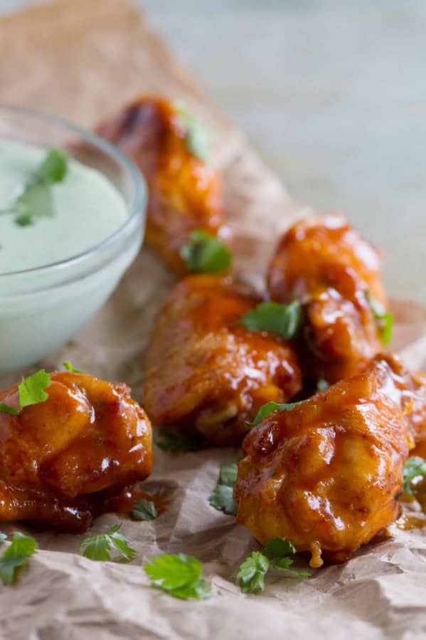 Enchilada Chicken Wings with cilantro dipping sauce.