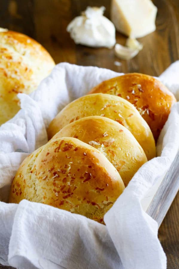 Garlic Parmesan Brioche Buns stacked together.