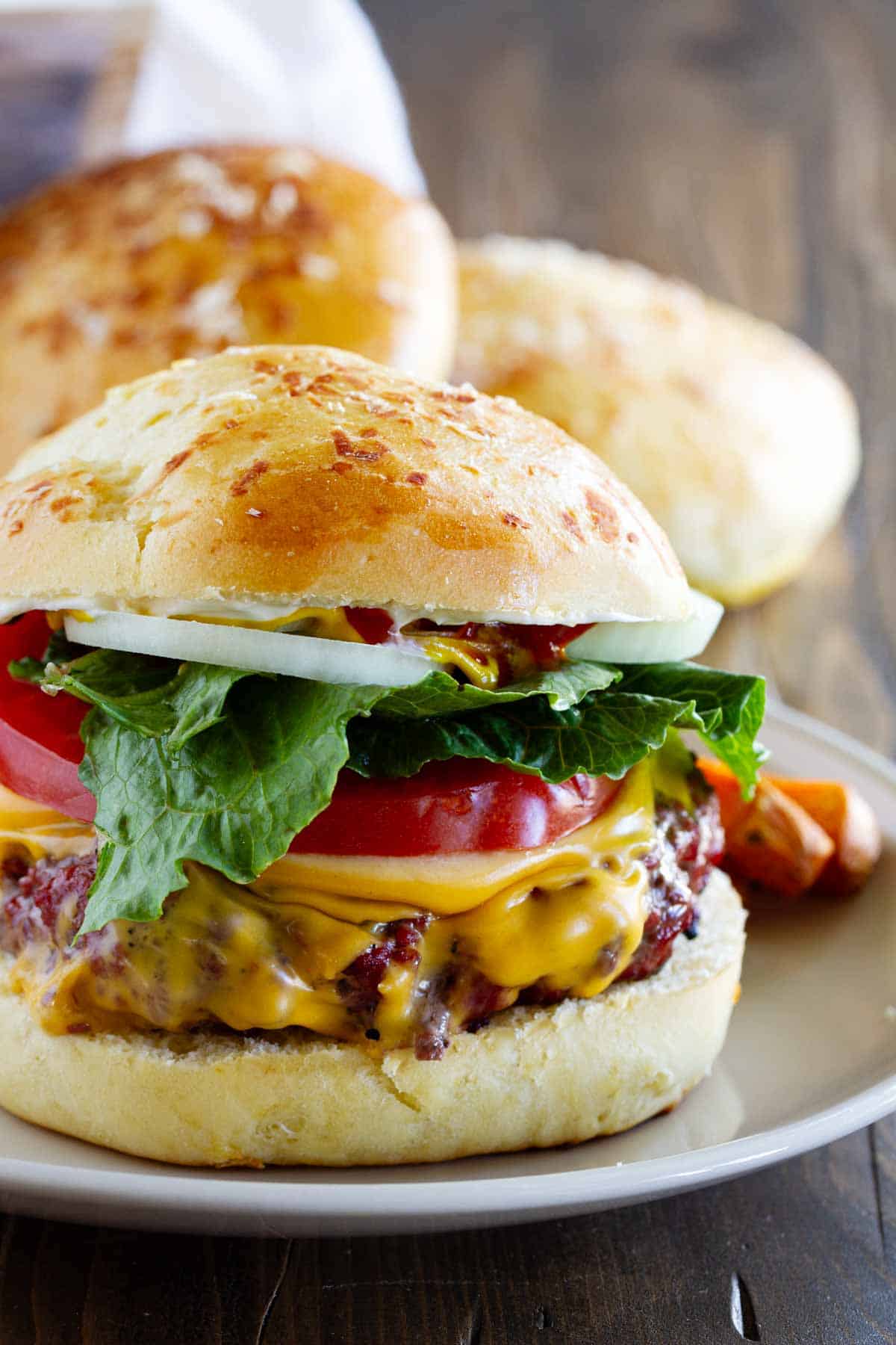 Hamburger made on a Garlic Parmesan Brioche Bun.