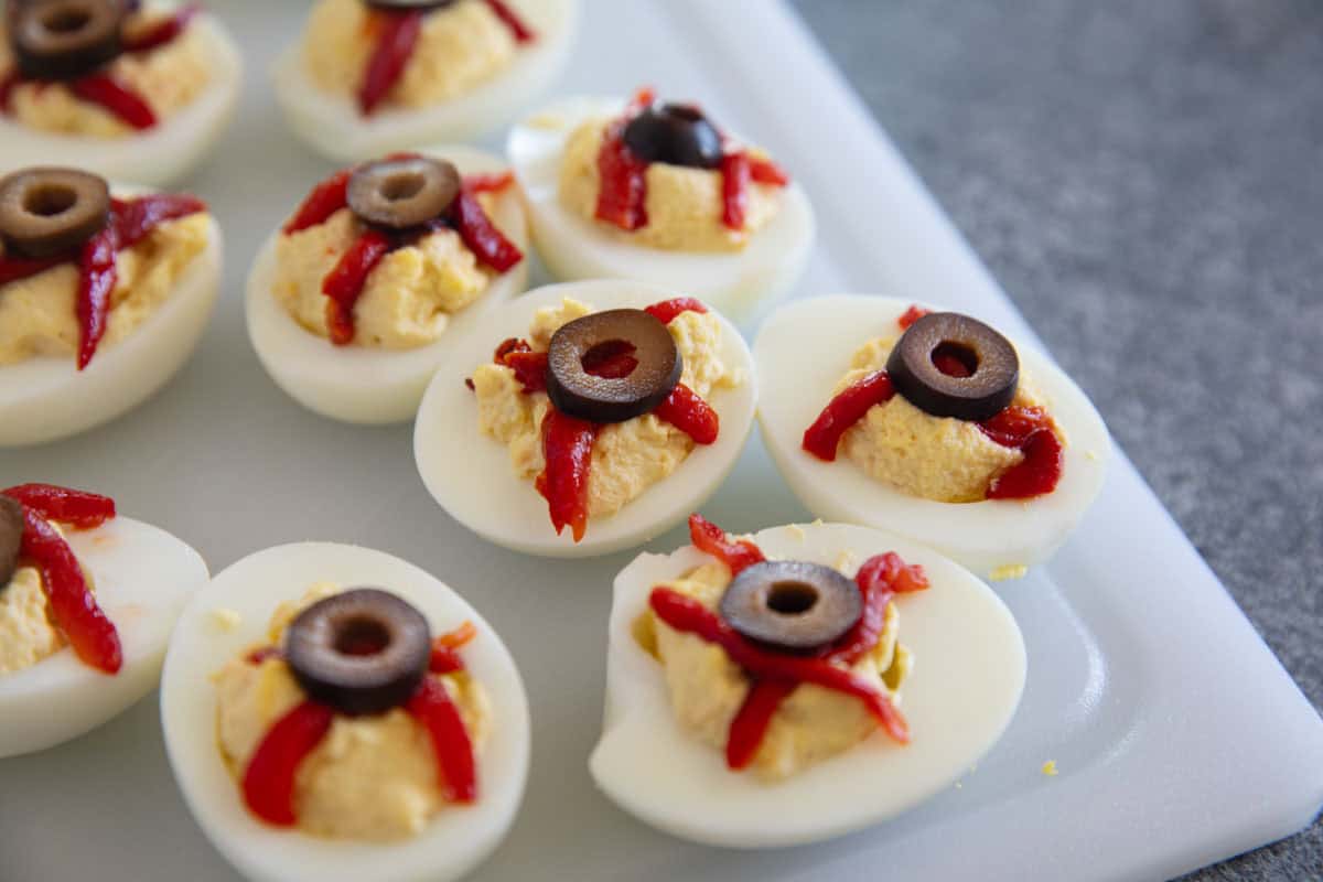 Deviled eggs decorated as eyeballs for Halloween.